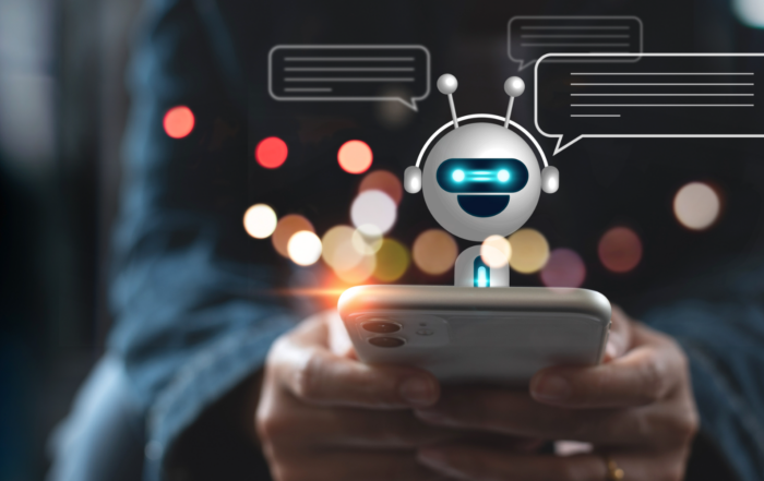 Hands typing on phone and interacting with chatbot