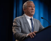 RFK Jr standing at podium